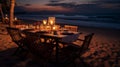 Romantic dinner setting on the beach at sunset Royalty Free Stock Photo