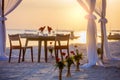 Romantic dinner setting on the beach at sunset Royalty Free Stock Photo