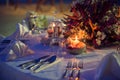 Romantic dinner setting on the beach at sunset Royalty Free Stock Photo