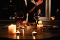 romantic dinner setting, red wine in glasses and candles, date for two, Valentine& x27;s Day evening Royalty Free Stock Photo