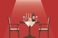 Romantic dinner setting with two chairs facing a round table draped in a white tablecloth against a red background Royalty Free Stock Photo