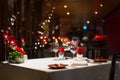 Romantic dinner setup, red decoration with candle light in a res Royalty Free Stock Photo