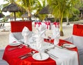 Romantic dinner on sunset beach. Table place setting Royalty Free Stock Photo