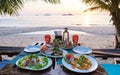 Romantic dinner during sunset on a tropical beach in Thailand, Koh Chang island Royalty Free Stock Photo