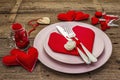 Romantic dinner table. Love concept for Valentines or mother`s day, wedding cutlery. Vintage wooden boards background