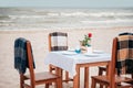 Romantic dinner table on sea shore. Preparing for dinner in restaurant by sea