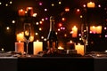 Romantic dinner table setting with burning candles Royalty Free Stock Photo