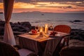 Romantic dinner on the terrace of a luxury villa on the sea at sunset, AI Generated