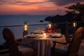Romantic dinner on the terrace with sea view at sunset, AI Generated