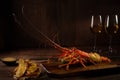 Red lobster with croutons and sauce and two glass of white wine Royalty Free Stock Photo