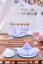 Romantic dinning table on the beach . Table setting at a luxury wedding and Beautiful flowers on the table. Royalty Free Stock Photo