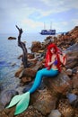 Romantic dreamer girl in mermaid costume on sea side