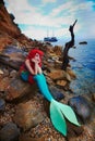 Romantic dreamer girl in mermaid costume on sea side