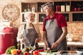 Romantic elderly couple cooking together on kitchen at home Royalty Free Stock Photo