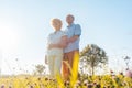 Romantic elderly couple enjoying health and nature in a sunny da