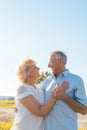 Romantic elderly couple enjoying health and nature in a sunny day