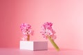 Romantic elegance white square podium with levitate spring hyacinth flowers in sunlight on soft light pastel pink background.