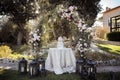Setup for the wedding cake cutting in the garden Royalty Free Stock Photo