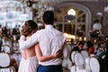 Romantic embracement of the just married couple in the restaurant Royalty Free Stock Photo