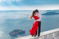 Romantic embracing couple beside blue sea in front of Sveti Stefan, Montenegro. Young woman with her groom. Travel. Vacations. Fa