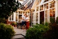 Romance evening in garden of couple expecting baby Royalty Free Stock Photo