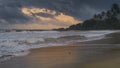 Romantic evening and the dramatic sunset on the beach in paradise island of Sri Lanka. Powerful tides crashing and washing the