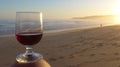 Romantic evening mood at the sea with a glass of red wine. Royalty Free Stock Photo