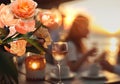 sunset beach at sea caffee cafe ,cup of coffee ,glass of wine,weet cake and flowers on table ,romantic couple relaxing, Royalty Free Stock Photo