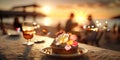 romantic sunset beach at sea caffee cafe ,cup of coffee ,sweet cake and flowers on table ,romantic couple relaxing, Royalty Free Stock Photo