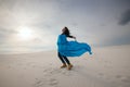 Romantic expressive girl, with open arms in desert Royalty Free Stock Photo