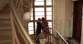 Romantic farewell of lovers on the steps of an old apartment building Royalty Free Stock Photo