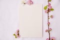 Romantic feminine vertical mockup of stationery card with spring white and pink flowers. Wedding, birthday