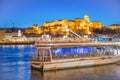 Romantic ferry at sunset in Budapest along Danube river with view on city castle, Hungary Royalty Free Stock Photo