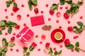 Romantic flat lay composition for Valentine's day. Red roses, hearts, coffee cup, gift box, chocolate, candles and