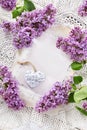 Romantic flat lay with lilac blossoms on vintage style table