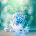 Romantic floral artistic background with blue flowers and bokeh