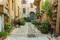 Romantic floral street in Spello, medieval town in Umbria, Italy. Famous for narrow lanes and balconies and windows with flowers
