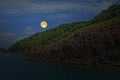 Romantic full moon over the island and the sea Royalty Free Stock Photo