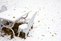 Snow covered garden table and chairs Royalty Free Stock Photo