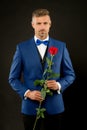 Romantic gentleman. Man mature confident macho with romantic gift. Handsome guy rose flower romantic date. Well groomed