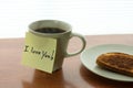 Romantic gesture I love You! note on hot cup of coffee in morning light Royalty Free Stock Photo