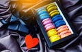 Romantic gift concept with macaroons, gift box and red heart Royalty Free Stock Photo