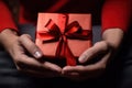 romantic gift for woman, male hands hold red gift box for female holiday day generative ai Royalty Free Stock Photo