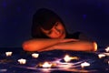 Romantic girl and candles Royalty Free Stock Photo