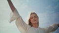 Romantic girl enjoy wind standing sunlight close up. Woman raising hands to sky. Royalty Free Stock Photo