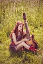 Romantic girl holding her guitar Royalty Free Stock Photo