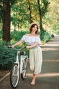 Romantic girl quickly comes with a bicycle Royalty Free Stock Photo