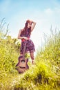Romantic girl travelling with her guitar Royalty Free Stock Photo