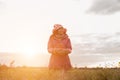 Give the gift on the Day of LoveRomantic girl walking in a field in sunset light. Winter, autumn life Royalty Free Stock Photo