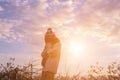 Give the gift on the Day of LoveRomantic girl walking in a field in sunset light. Winter, autumn life Royalty Free Stock Photo